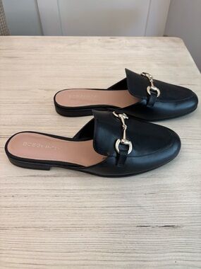 BCBGeneration Black Leather Backless Loafers with Gold Bit